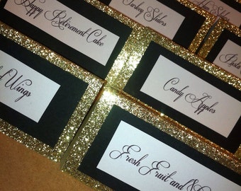 black glitter and gold glitter placecards for a party, shower, or wedding. Shown in a gatsby-inspired font, customizable