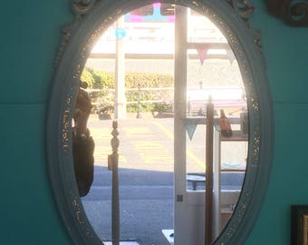 Ornate hand painted mirror.