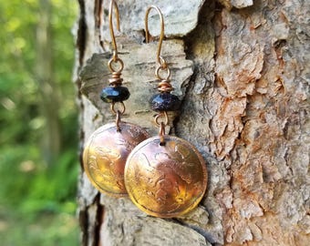 Handmade etched copper earrings.