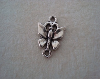 Between two silver coloured metal Butterfly