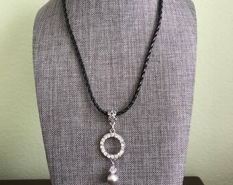 A simple pendant with a leather cord
