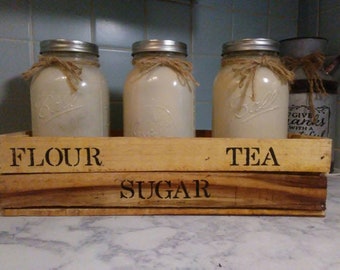 Set of three quart size mason jars with a beautiful wooden box made out of reclaimed wood.