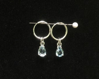 Blue topaz dangle hoop earrings.