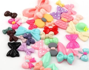 5 Flake-shaped resin cabochon/ribbons in different styles and sizes