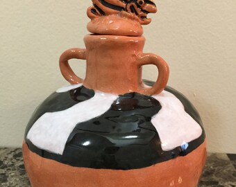 Fish-topped Traditional pottery