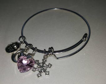 bracelet is silver plated charms and rhinestones