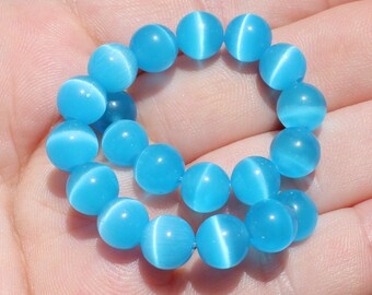5 ŒIL CAT MEXICAN OPAL BLUE 8 MM ROUND BEADS.