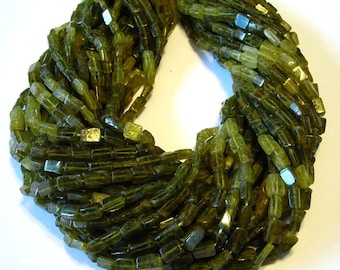 Grossular green garnet shaded rectangular beads full 14" stand.