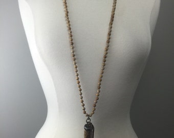 Hand knotted beaded necklace with soldered horn