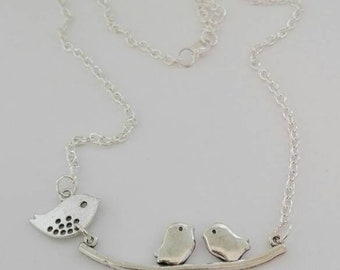 Necklace with silver-colored birds