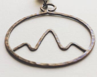 Hammered copper mountain pendant necklace