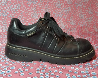 Black leather lace up chunky heel platforms by Skechers