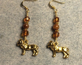Gold lion charm earrings adorned with amber agate beads and amber Czech glass beads.