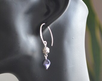 Silver earrings with dark purple Swarovski element.