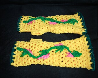 Yellow fingerless gloves crocheted with embroidery flowers