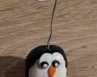 A polymer clay Penguin picture frames