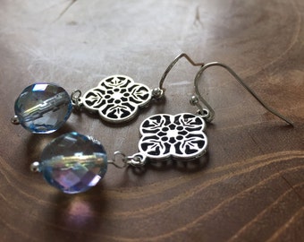 Water - Pair of dangling earrings with decorative, silvertone charm and blue glass bead with AB shine.