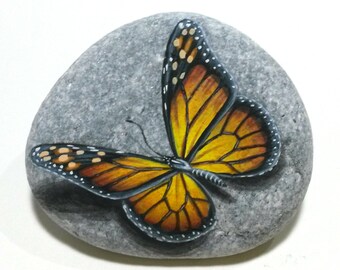Stone painting art monarch butterfly! Painted on natural flat sea stone with acrylics and finished with glossy varnish. Butterfly home decor