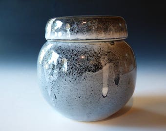 black, white and gray sugar bowl
