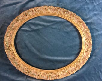 Antique gilded wood oval frame with heavy compo applied acanthus ornament