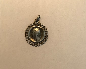 Religious silver filigree Mary medal Lourdes