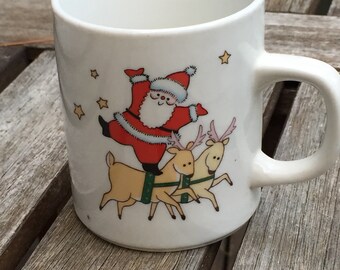 Santa danving with reindeer vintage coffee mug