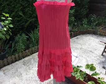 Strawberry silk pleated ruffle dress and closing a zipper at the back for cocktail or evening dress women
