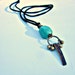 Black Faux Suede Cord No Clasp Necklace with Stone Shell and Brass Pendant: Pendulum