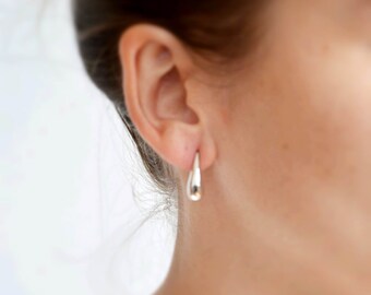 Silver earring in water drop shaped
