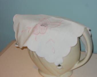 Pitcher cover made from vintage linen doily and vintage glass buttons