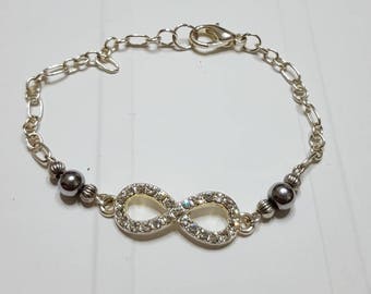 Infinity bracelet, rhinestone and silver Hematite