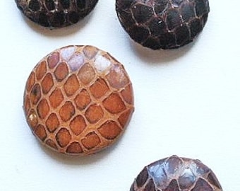 Reptile buttons, 4 different, vintage. 4 examples of reptile skin or hide. 3 pad backs, 1 metal back. c1930's to 40's.