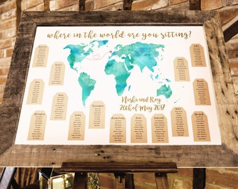 World map travel themed wedding seating plan made and personalised with couples locations