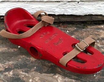 red weight shoe ~ red York Health Shoe aka the iron boot ~ from York Barbell ~ dumbbells for your feet ~ vintage sporting goods