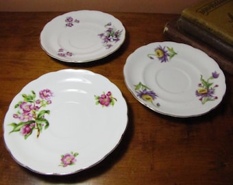 Three (3) Vintage Saucers - Floral Patterns