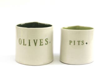 olives and pits ... hand built porcelain containers ... bold green vessels