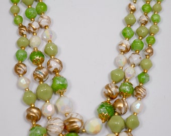 Vintage Necklace adjustable with three strands of different size beads marked Hong Kong, early 1950's