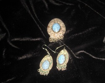 Vintage sterling silver brooch and earrings set; turquoise centers. Marked as sterling.