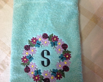 This monogrammed towel is embroidered on a hand towel. Can be put on a kitchen towel as well.