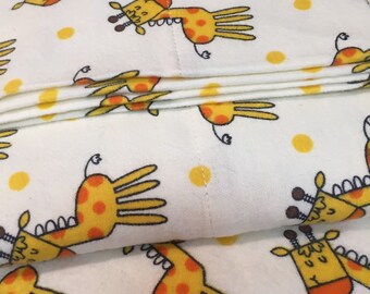 A giraffes themed print fitted sheet and a standard pillowcase