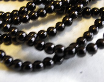 150 6 mm with a beautiful black non Pearlescent glass beads