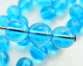 6mm Czech Druk Beads Round Transparent Aqua Blue (20pk) si-6DK-TAB