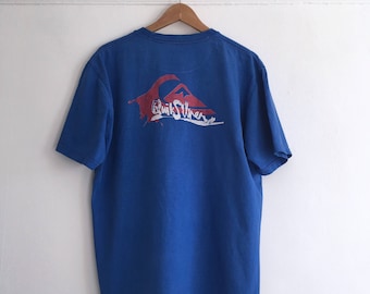 Vintage t shirt in blue. Made by Quick Sliver. Men's size L/XL. 90's era.