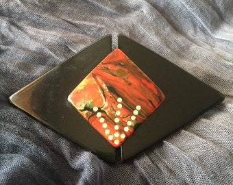 Pinza de pelo geométricos. Negro y multicolor con strass