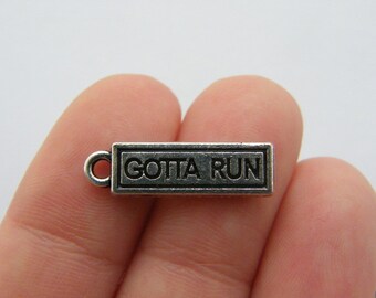 BULK 20 Gotta run charms antique silver tone SP191