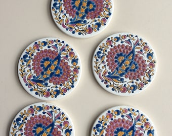 5 round ceramic tiles/coasters. Made by Niarchos