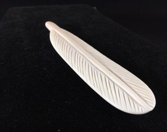 Bone feather w/ hole drilled
