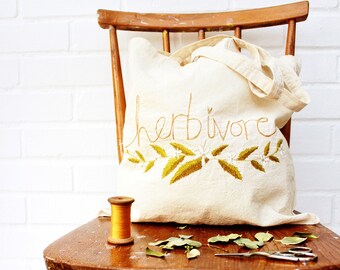 herbivore slogan tote bag recycled calico ( vegan )