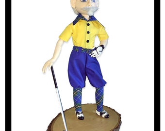 Mulligan is a pattern for a 17.5" fabric doll with needle sculpted face and hands, and clay shoes and putter.