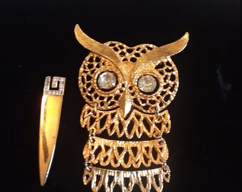 Segmented owl and sword shaped brooches